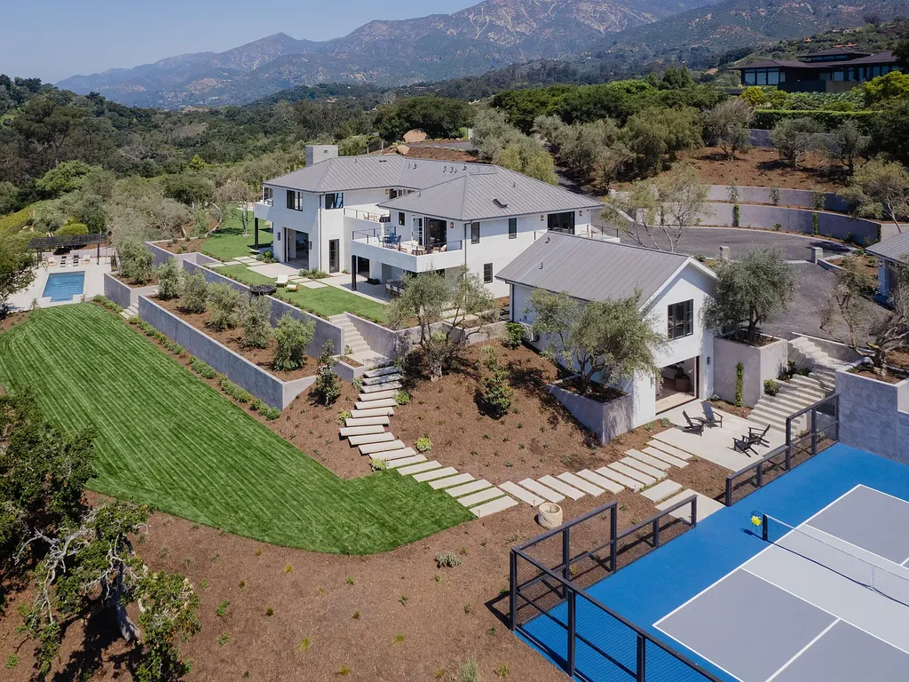 2957 E Valley Road Home in Santa Barbara, California. Embark on an extraordinary journey as you step into this newly completed, expertly designed compound boasting breathtaking ocean, mountain, and hillside views. With a harmonious blend of modern aesthetics and a romantic ambiance, this property is a testament to patience and the pursuit of perfection. Welcome to a haven where high design seamlessly merges with relaxed livability, creating an unparalleled living experience.