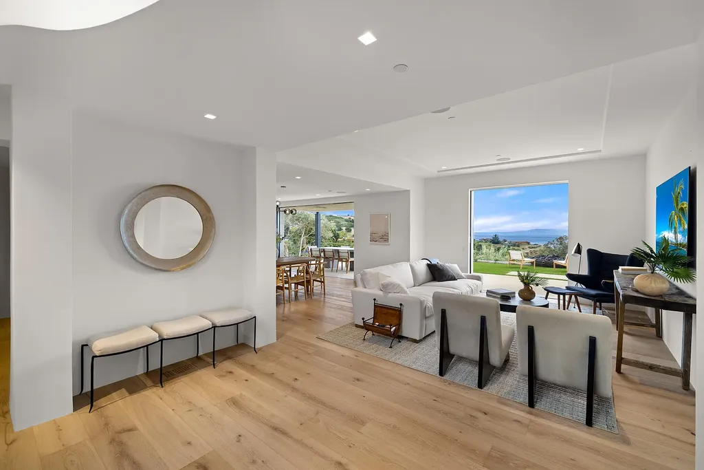 2957 E Valley Road Home in Santa Barbara, California. Embark on an extraordinary journey as you step into this newly completed, expertly designed compound boasting breathtaking ocean, mountain, and hillside views. With a harmonious blend of modern aesthetics and a romantic ambiance, this property is a testament to patience and the pursuit of perfection. Welcome to a haven where high design seamlessly merges with relaxed livability, creating an unparalleled living experience.