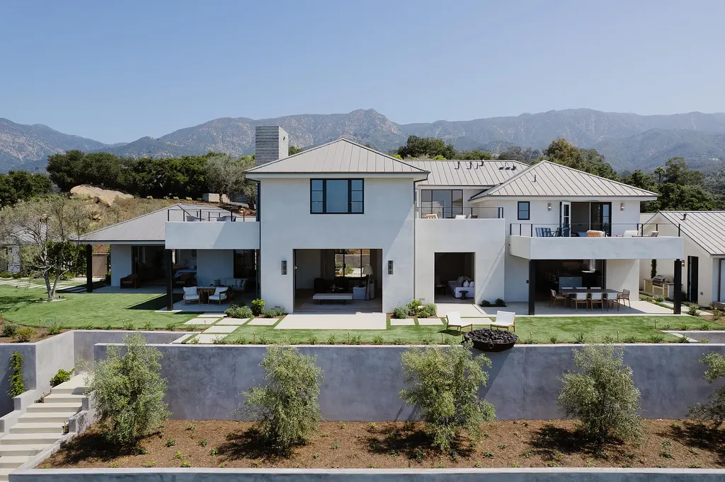2957 E Valley Road Home in Santa Barbara, California. Embark on an extraordinary journey as you step into this newly completed, expertly designed compound boasting breathtaking ocean, mountain, and hillside views. With a harmonious blend of modern aesthetics and a romantic ambiance, this property is a testament to patience and the pursuit of perfection. Welcome to a haven where high design seamlessly merges with relaxed livability, creating an unparalleled living experience.