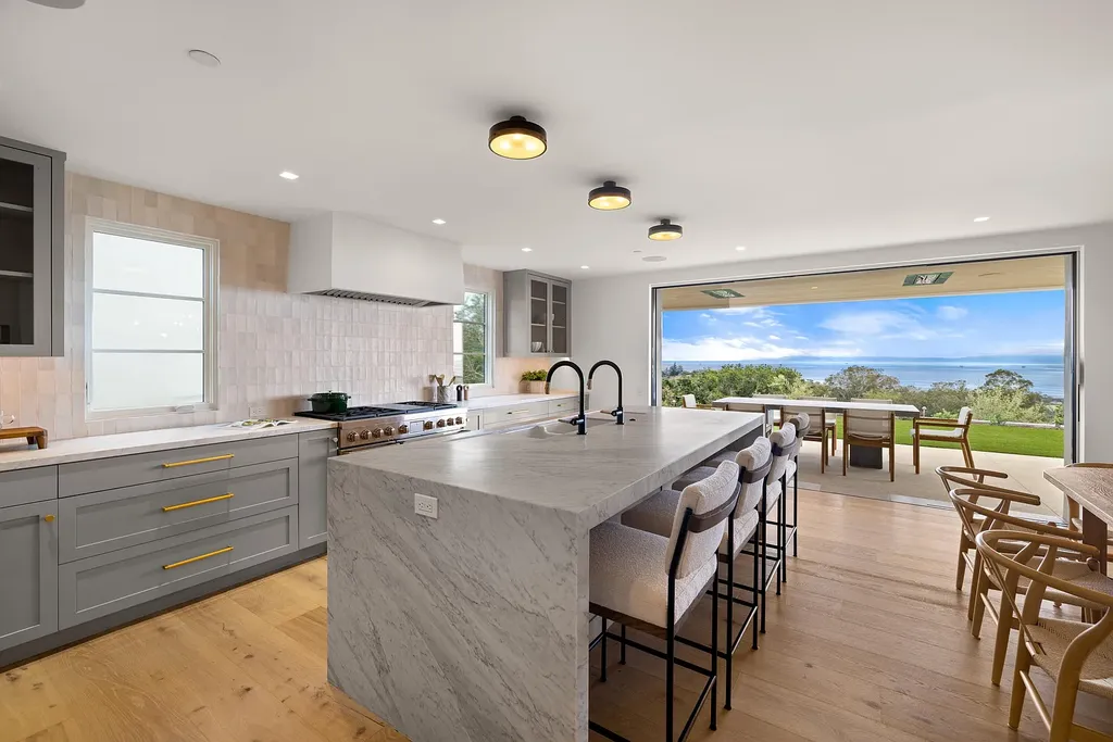 2957 E Valley Road Home in Santa Barbara, California. Embark on an extraordinary journey as you step into this newly completed, expertly designed compound boasting breathtaking ocean, mountain, and hillside views. With a harmonious blend of modern aesthetics and a romantic ambiance, this property is a testament to patience and the pursuit of perfection. Welcome to a haven where high design seamlessly merges with relaxed livability, creating an unparalleled living experience.