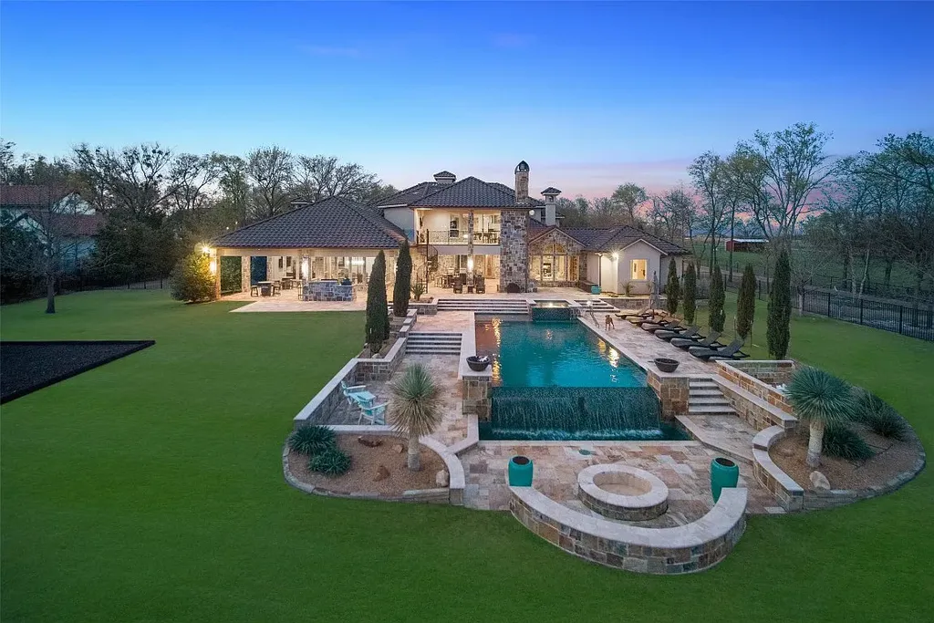Experience the perfect blend of Texas Hill Country charm and modern urban living in this exceptional 5-bedroom, 6-bathroom home located on a peaceful cul-de-sac and nestled on 2.3 acres of scenic beauty, with the added advantage of being adjacent to an equestrian farm. The thoughtfully designed interiors showcase light woods, warm stones, and expansive windows, creating inviting and bright spaces throughout.