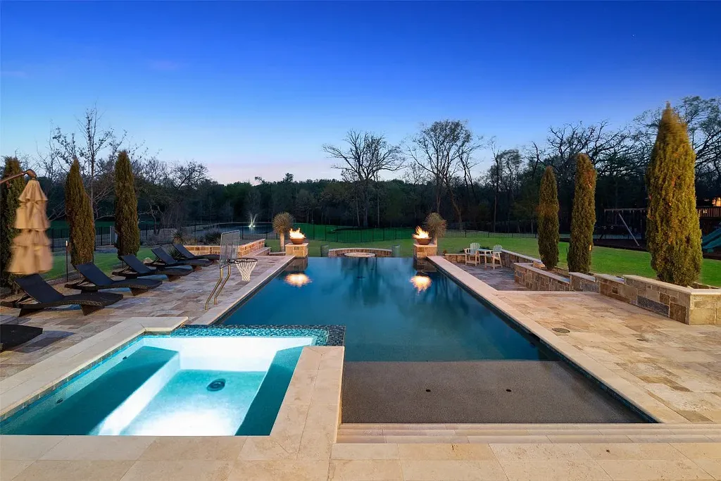 Experience the perfect blend of Texas Hill Country charm and modern urban living in this exceptional 5-bedroom, 6-bathroom home located on a peaceful cul-de-sac and nestled on 2.3 acres of scenic beauty, with the added advantage of being adjacent to an equestrian farm. The thoughtfully designed interiors showcase light woods, warm stones, and expansive windows, creating inviting and bright spaces throughout.