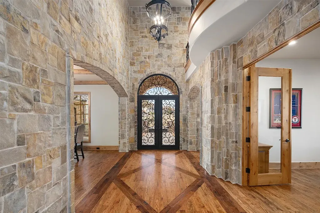 Experience the perfect blend of Texas Hill Country charm and modern urban living in this exceptional 5-bedroom, 6-bathroom home located on a peaceful cul-de-sac and nestled on 2.3 acres of scenic beauty, with the added advantage of being adjacent to an equestrian farm. The thoughtfully designed interiors showcase light woods, warm stones, and expansive windows, creating inviting and bright spaces throughout.