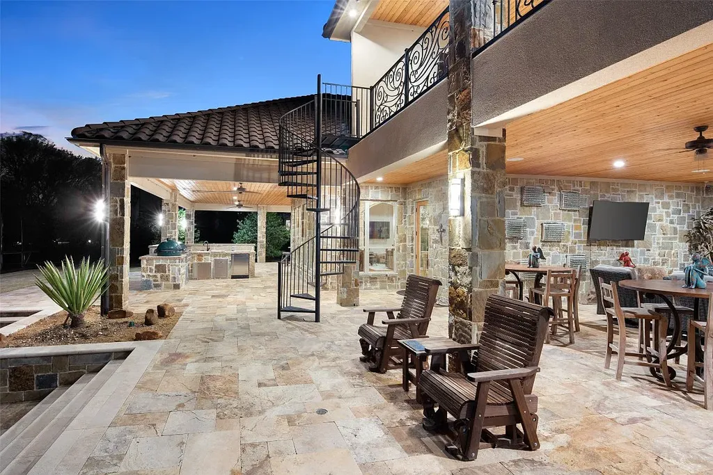 Experience the perfect blend of Texas Hill Country charm and modern urban living in this exceptional 5-bedroom, 6-bathroom home located on a peaceful cul-de-sac and nestled on 2.3 acres of scenic beauty, with the added advantage of being adjacent to an equestrian farm. The thoughtfully designed interiors showcase light woods, warm stones, and expansive windows, creating inviting and bright spaces throughout.
