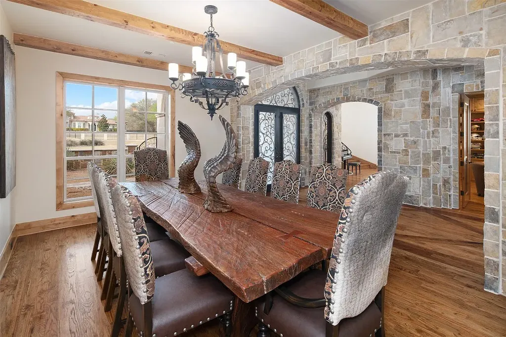 Experience the perfect blend of Texas Hill Country charm and modern urban living in this exceptional 5-bedroom, 6-bathroom home located on a peaceful cul-de-sac and nestled on 2.3 acres of scenic beauty, with the added advantage of being adjacent to an equestrian farm. The thoughtfully designed interiors showcase light woods, warm stones, and expansive windows, creating inviting and bright spaces throughout.