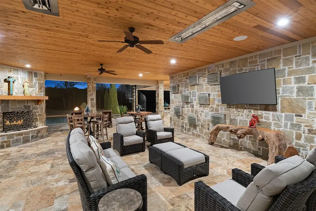 Experience the perfect blend of Texas Hill Country charm and modern urban living in this exceptional 5-bedroom, 6-bathroom home located on a peaceful cul-de-sac and nestled on 2.3 acres of scenic beauty, with the added advantage of being adjacent to an equestrian farm. The thoughtfully designed interiors showcase light woods, warm stones, and expansive windows, creating inviting and bright spaces throughout.