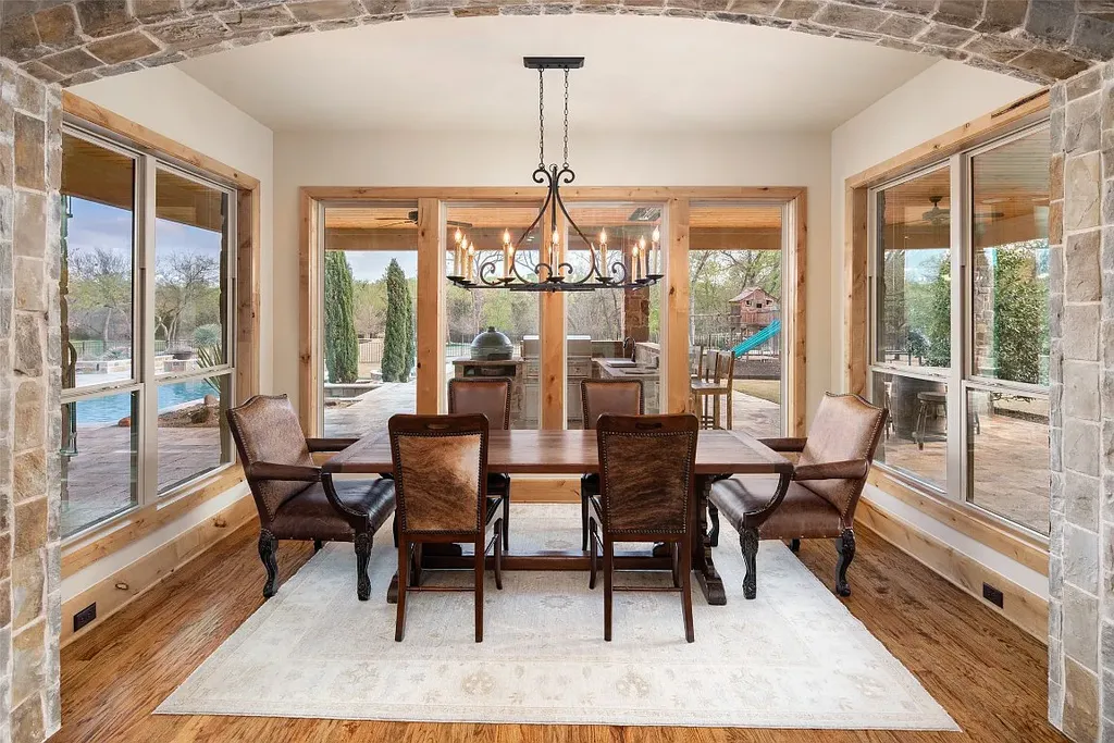 Experience the perfect blend of Texas Hill Country charm and modern urban living in this exceptional 5-bedroom, 6-bathroom home located on a peaceful cul-de-sac and nestled on 2.3 acres of scenic beauty, with the added advantage of being adjacent to an equestrian farm. The thoughtfully designed interiors showcase light woods, warm stones, and expansive windows, creating inviting and bright spaces throughout.