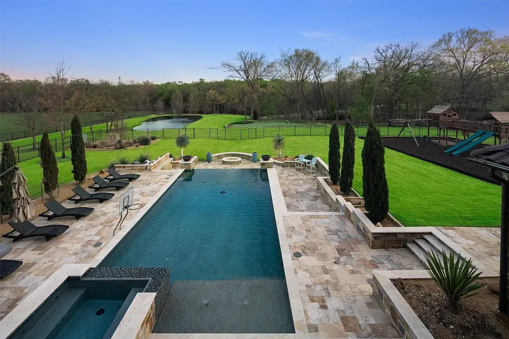 Experience the perfect blend of Texas Hill Country charm and modern urban living in this exceptional 5-bedroom, 6-bathroom home located on a peaceful cul-de-sac and nestled on 2.3 acres of scenic beauty, with the added advantage of being adjacent to an equestrian farm. The thoughtfully designed interiors showcase light woods, warm stones, and expansive windows, creating inviting and bright spaces throughout.