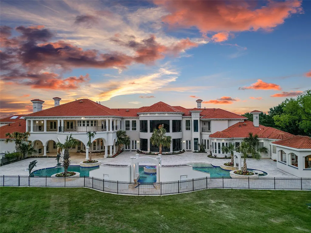 3712 Dustin Trail Home in Dalworthington Gardens, Texas. Experience the epitome of luxury and exclusivity with this breathtaking gated resort home situated on an expansive 8.5-acre estate. Every detail of this grand celebrity-style residence has been meticulously crafted, from the majestic cathedral ceilings to the mesmerizing views of the resort-style oasis.