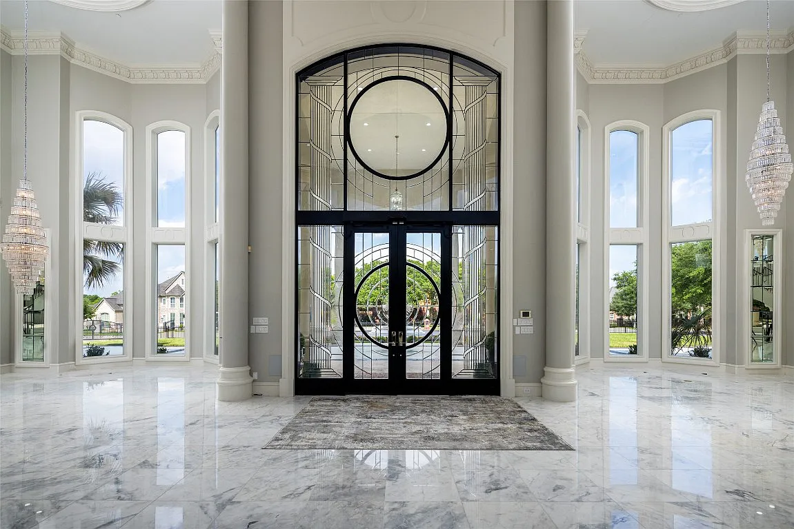 3712 Dustin Trail Home in Dalworthington Gardens, Texas. Experience the epitome of luxury and exclusivity with this breathtaking gated resort home situated on an expansive 8.5-acre estate. Every detail of this grand celebrity-style residence has been meticulously crafted, from the majestic cathedral ceilings to the mesmerizing views of the resort-style oasis.