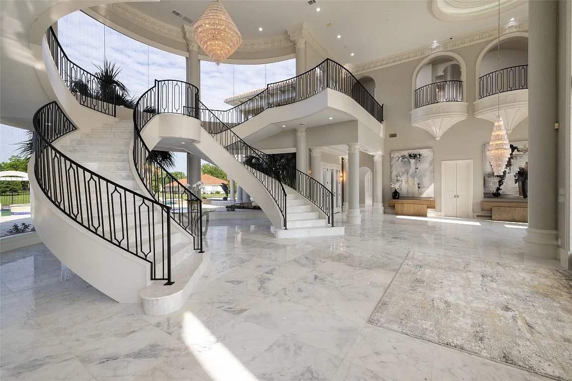 3712 Dustin Trail Home in Dalworthington Gardens, Texas. Experience the epitome of luxury and exclusivity with this breathtaking gated resort home situated on an expansive 8.5-acre estate. Every detail of this grand celebrity-style residence has been meticulously crafted, from the majestic cathedral ceilings to the mesmerizing views of the resort-style oasis.