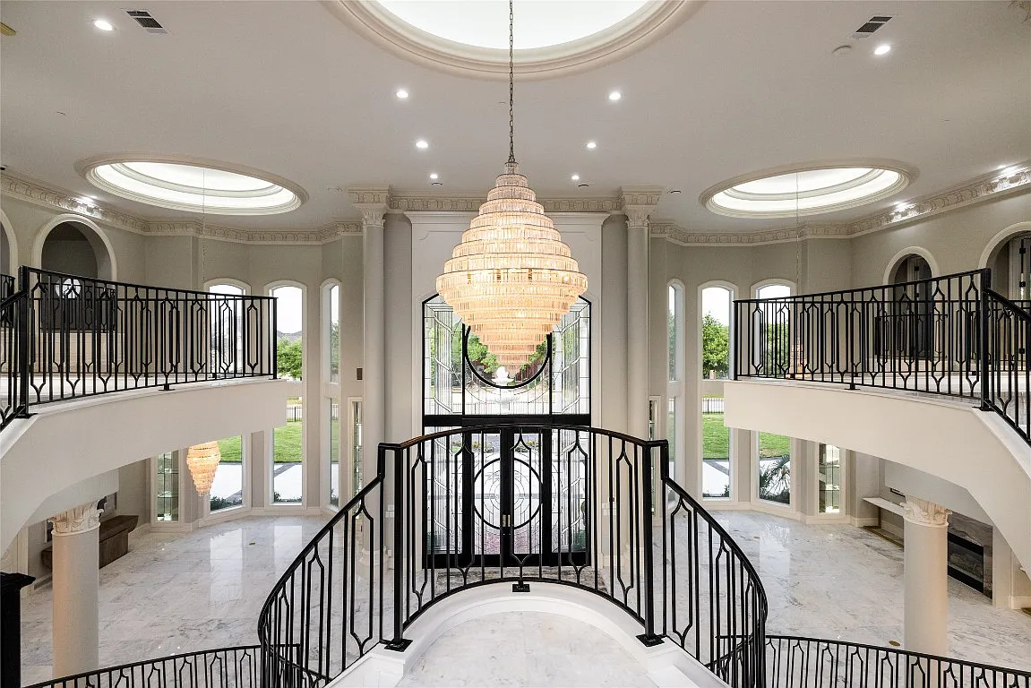 3712 Dustin Trail Home in Dalworthington Gardens, Texas. Experience the epitome of luxury and exclusivity with this breathtaking gated resort home situated on an expansive 8.5-acre estate. Every detail of this grand celebrity-style residence has been meticulously crafted, from the majestic cathedral ceilings to the mesmerizing views of the resort-style oasis.