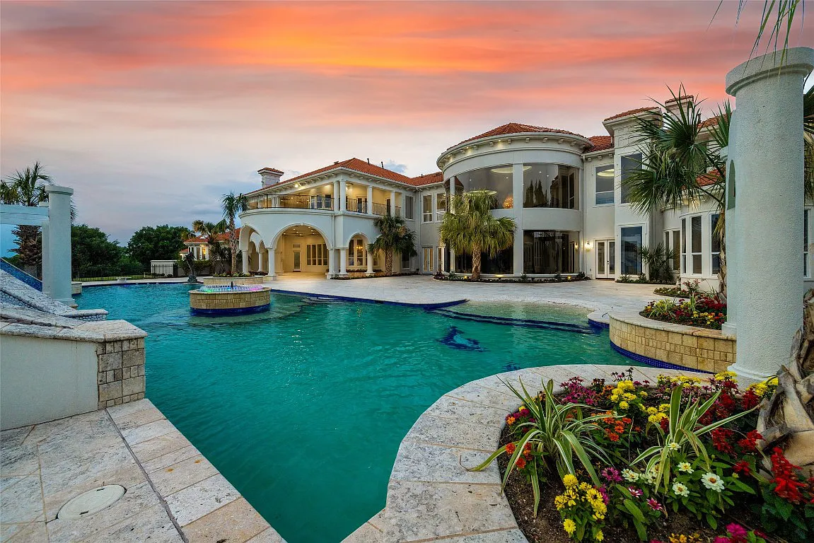 3712 Dustin Trail Home in Dalworthington Gardens, Texas. Experience the epitome of luxury and exclusivity with this breathtaking gated resort home situated on an expansive 8.5-acre estate. Every detail of this grand celebrity-style residence has been meticulously crafted, from the majestic cathedral ceilings to the mesmerizing views of the resort-style oasis.