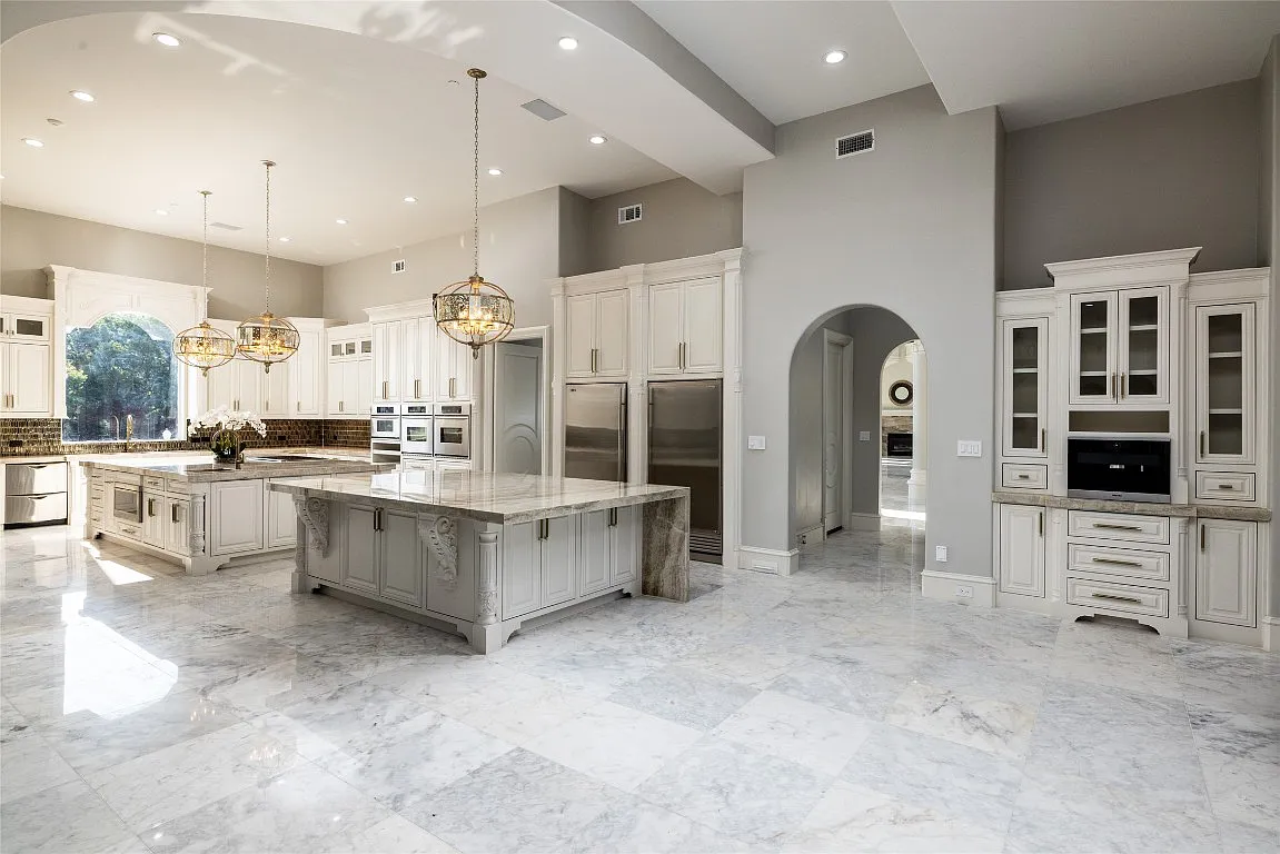 3712 Dustin Trail Home in Dalworthington Gardens, Texas. Experience the epitome of luxury and exclusivity with this breathtaking gated resort home situated on an expansive 8.5-acre estate. Every detail of this grand celebrity-style residence has been meticulously crafted, from the majestic cathedral ceilings to the mesmerizing views of the resort-style oasis.