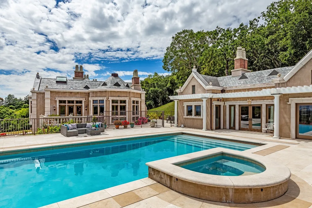 490 Las Pulgas Drive Home in Woodside, California. Step into a world of opulence and European elegance in this extraordinary residence situated on 5.32 acres of private gated land. Crafted with impeccable attention to detail by renowned builder Markay Johnson in 2014, this home offers breathtaking views of the San Francisco Bay. 
