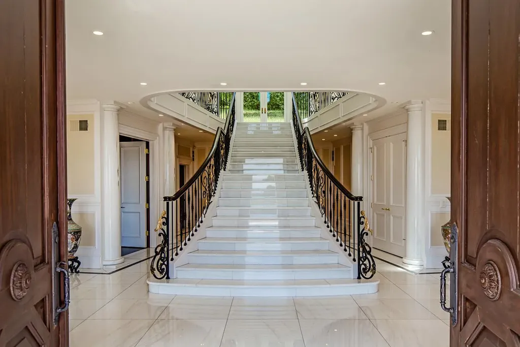490 Las Pulgas Drive Home in Woodside, California. Step into a world of opulence and European elegance in this extraordinary residence situated on 5.32 acres of private gated land. Crafted with impeccable attention to detail by renowned builder Markay Johnson in 2014, this home offers breathtaking views of the San Francisco Bay. 