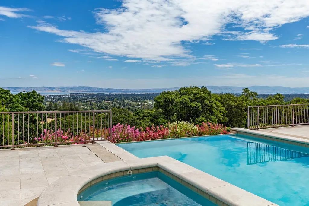 490 Las Pulgas Drive Home in Woodside, California. Step into a world of opulence and European elegance in this extraordinary residence situated on 5.32 acres of private gated land. Crafted with impeccable attention to detail by renowned builder Markay Johnson in 2014, this home offers breathtaking views of the San Francisco Bay. 
