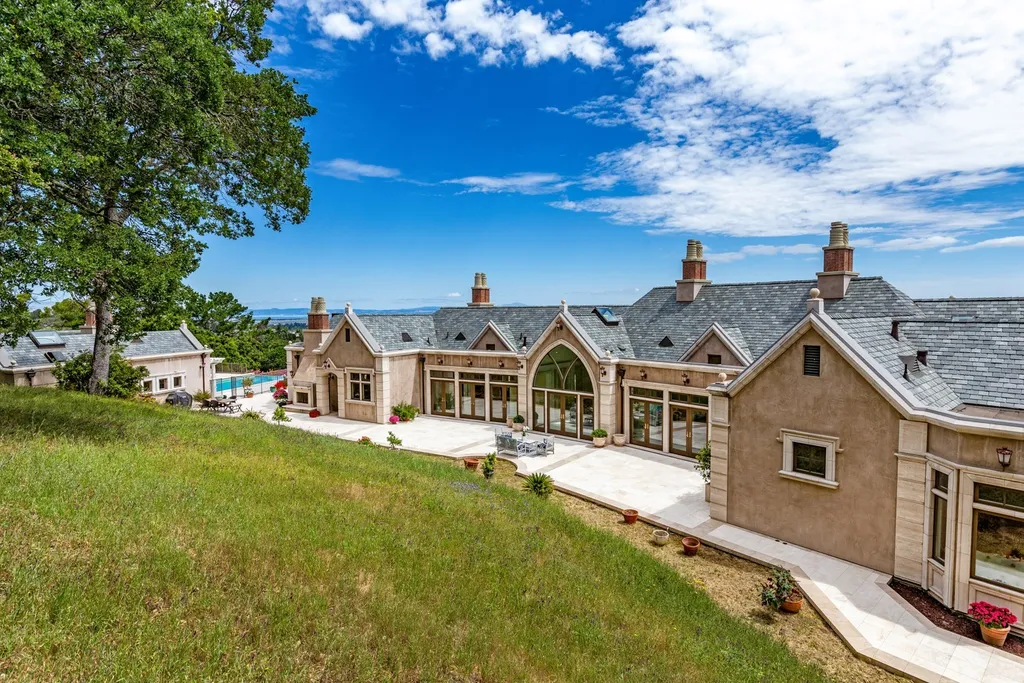 490 Las Pulgas Drive Home in Woodside, California. Step into a world of opulence and European elegance in this extraordinary residence situated on 5.32 acres of private gated land. Crafted with impeccable attention to detail by renowned builder Markay Johnson in 2014, this home offers breathtaking views of the San Francisco Bay. 