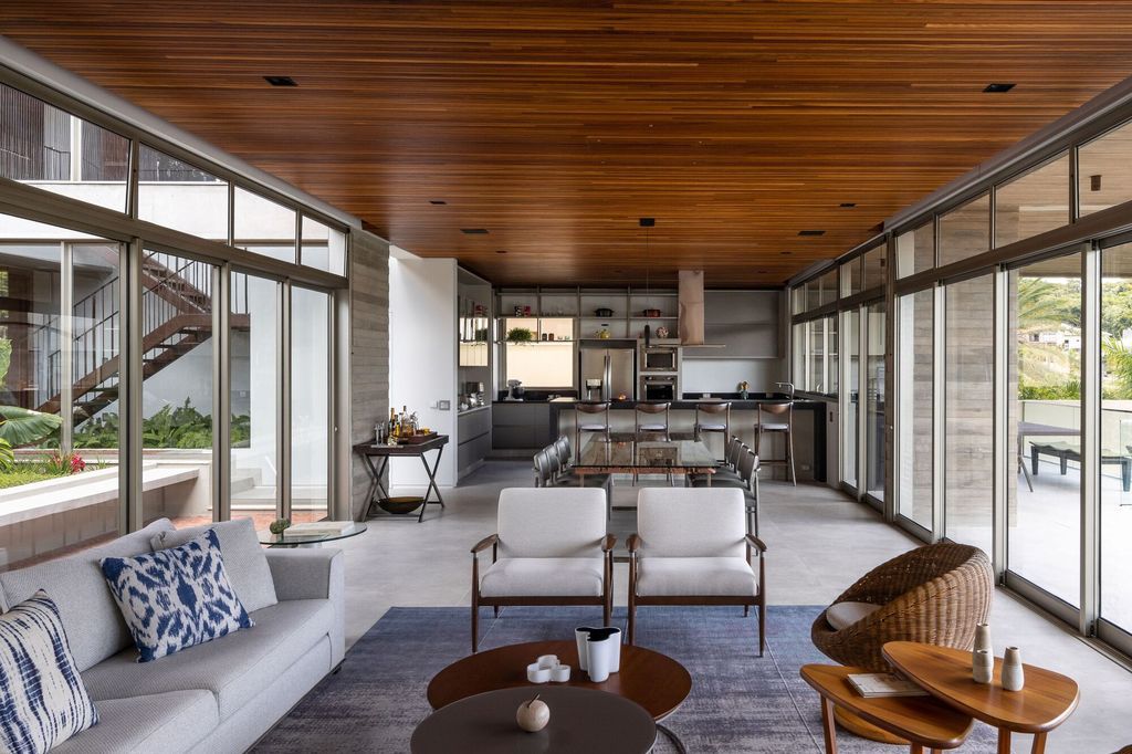 Axial House, harmonious connection with surroundings by TAU Arquitetos