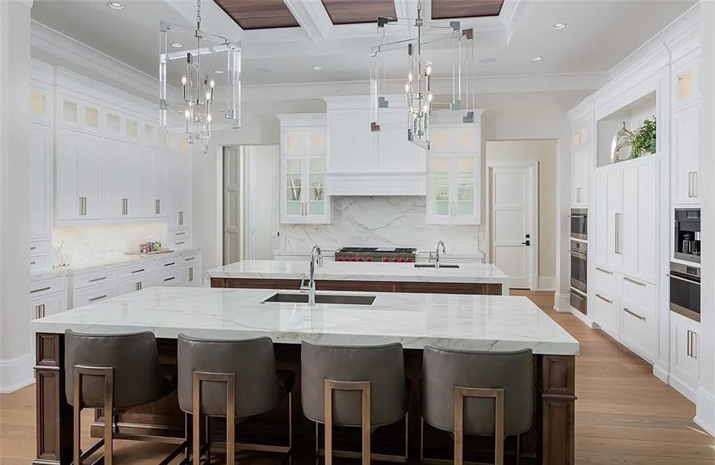 Welcome to 149 Cajeput Drive, Naples, Florida - a newly constructed masterpiece of timeless elegance. This exceptional estate boasts 5 bedrooms, 8 bathrooms, and spans 9,833 square feet.