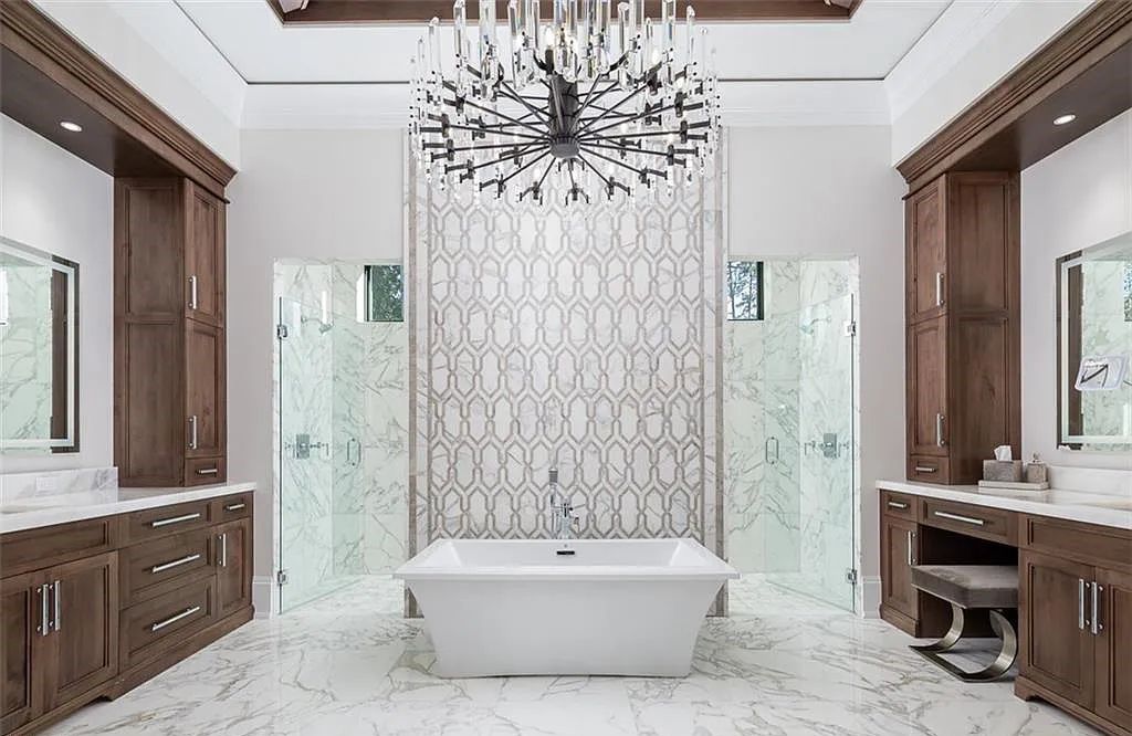Welcome to 149 Cajeput Drive, Naples, Florida - a newly constructed masterpiece of timeless elegance. This exceptional estate boasts 5 bedrooms, 8 bathrooms, and spans 9,833 square feet.