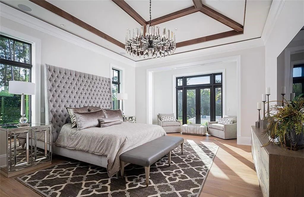 Welcome to 149 Cajeput Drive, Naples, Florida - a newly constructed masterpiece of timeless elegance. This exceptional estate boasts 5 bedrooms, 8 bathrooms, and spans 9,833 square feet.