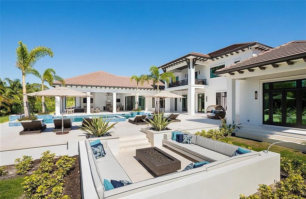Welcome to 149 Cajeput Drive, Naples, Florida - a newly constructed masterpiece of timeless elegance. This exceptional estate boasts 5 bedrooms, 8 bathrooms, and spans 9,833 square feet.
