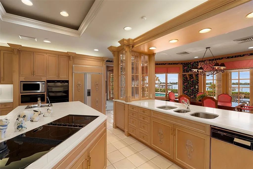 Discover 1405 Kimlira Lane, an exquisite Bayfront estate in Sarasota, Florida. Situated on 1.1 acres with 170 ft of shoreline, this 12,724 square feet masterpiece offers unparalleled luxury.