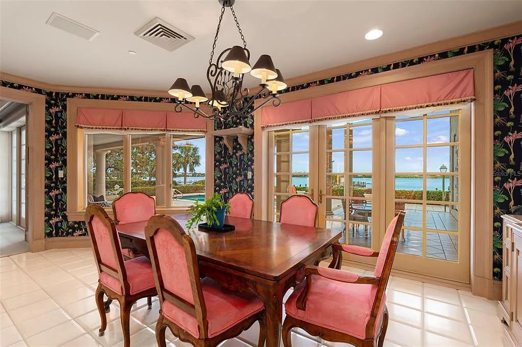 Discover 1405 Kimlira Lane, an exquisite Bayfront estate in Sarasota, Florida. Situated on 1.1 acres with 170 ft of shoreline, this 12,724 square feet masterpiece offers unparalleled luxury.