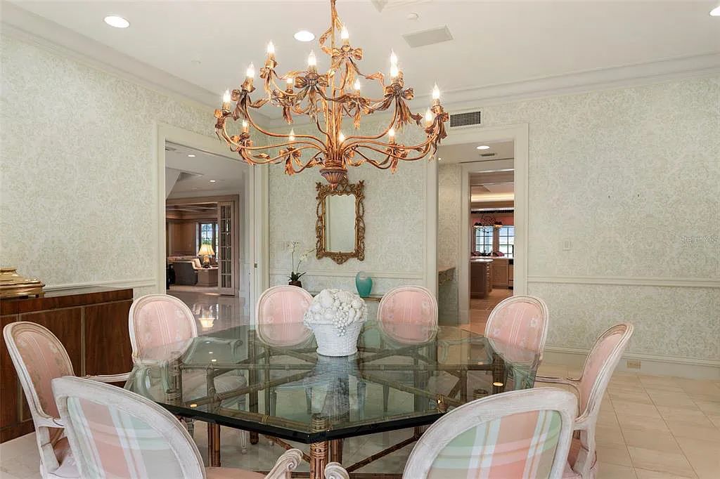 Discover 1405 Kimlira Lane, an exquisite Bayfront estate in Sarasota, Florida. Situated on 1.1 acres with 170 ft of shoreline, this 12,724 square feet masterpiece offers unparalleled luxury.