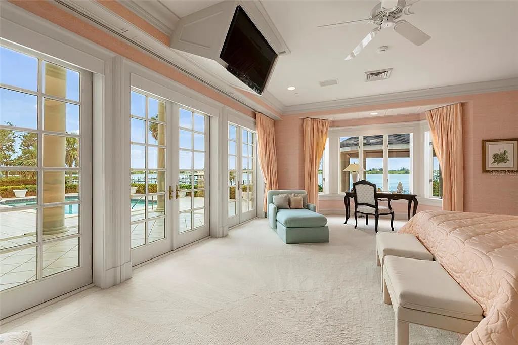 Discover 1405 Kimlira Lane, an exquisite Bayfront estate in Sarasota, Florida. Situated on 1.1 acres with 170 ft of shoreline, this 12,724 square feet masterpiece offers unparalleled luxury.