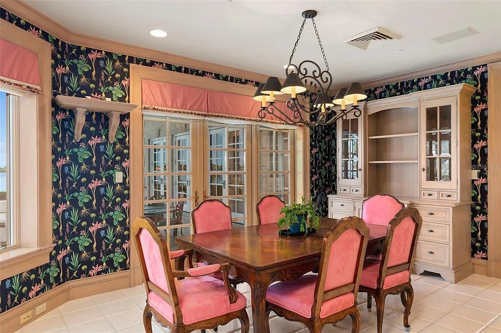 Discover 1405 Kimlira Lane, an exquisite Bayfront estate in Sarasota, Florida. Situated on 1.1 acres with 170 ft of shoreline, this 12,724 square feet masterpiece offers unparalleled luxury.