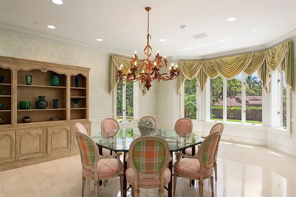 Discover 1405 Kimlira Lane, an exquisite Bayfront estate in Sarasota, Florida. Situated on 1.1 acres with 170 ft of shoreline, this 12,724 square feet masterpiece offers unparalleled luxury.