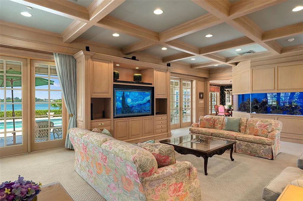 Discover 1405 Kimlira Lane, an exquisite Bayfront estate in Sarasota, Florida. Situated on 1.1 acres with 170 ft of shoreline, this 12,724 square feet masterpiece offers unparalleled luxury.