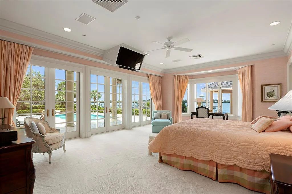 Discover 1405 Kimlira Lane, an exquisite Bayfront estate in Sarasota, Florida. Situated on 1.1 acres with 170 ft of shoreline, this 12,724 square feet masterpiece offers unparalleled luxury.