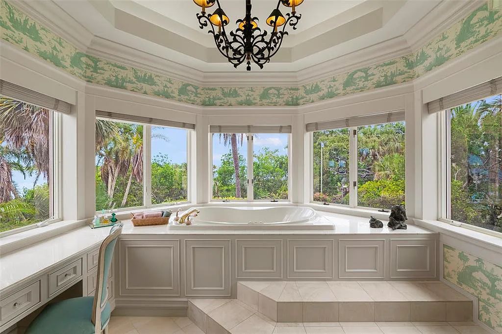 Discover 1405 Kimlira Lane, an exquisite Bayfront estate in Sarasota, Florida. Situated on 1.1 acres with 170 ft of shoreline, this 12,724 square feet masterpiece offers unparalleled luxury.