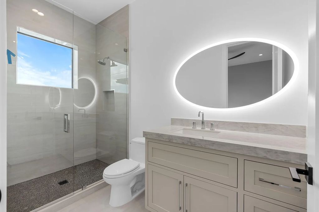Introducing 55 River Drive, a brand new waterfront residence in Tequesta, Florida. This stunning home offers direct ocean access and boasts 100 feet of wide water views.