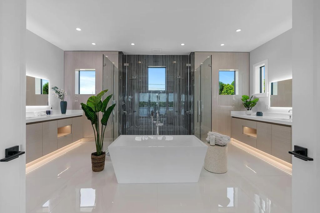 Introducing 55 River Drive, a brand new waterfront residence in Tequesta, Florida. This stunning home offers direct ocean access and boasts 100 feet of wide water views.