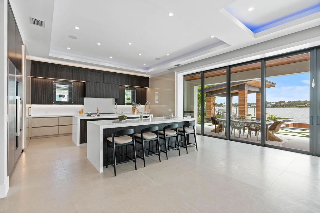 Introducing 55 River Drive, a brand new waterfront residence in Tequesta, Florida. This stunning home offers direct ocean access and boasts 100 feet of wide water views.