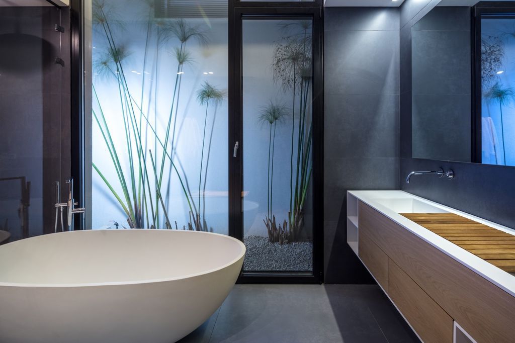 House F creates clean, modern & in-outdoor spaces by A.M.N Architecture