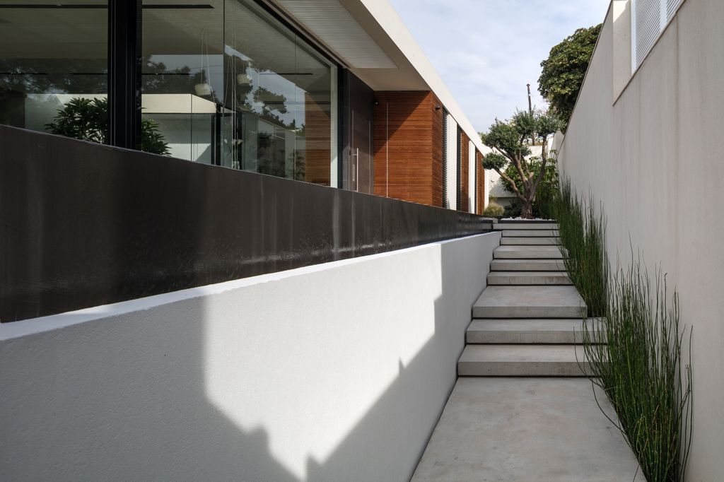 House F creates clean, modern & in-outdoor spaces by A.M.N Architecture