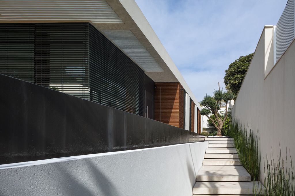 House F creates clean, modern & in-outdoor spaces by A.M.N Architecture