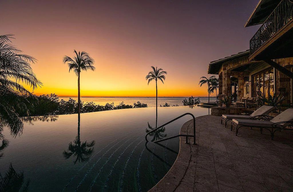 Introducing 1300 Sunset Boulevard, Tarpon Ranch—an elegant private estate in Summerland Key, Florida. Just minutes from Key West, this luxurious property offers relaxed coastal living at its finest. With 6 bedrooms, 8 bathrooms, and 7,720 square feet of living space on a 1.35-acre lot, it's a masterpiece of architectural splendor.