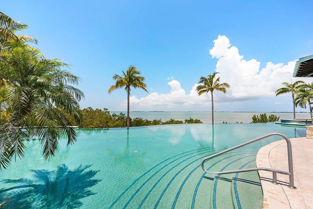 Introducing 1300 Sunset Boulevard, Tarpon Ranch—an elegant private estate in Summerland Key, Florida. Just minutes from Key West, this luxurious property offers relaxed coastal living at its finest. With 6 bedrooms, 8 bathrooms, and 7,720 square feet of living space on a 1.35-acre lot, it's a masterpiece of architectural splendor.