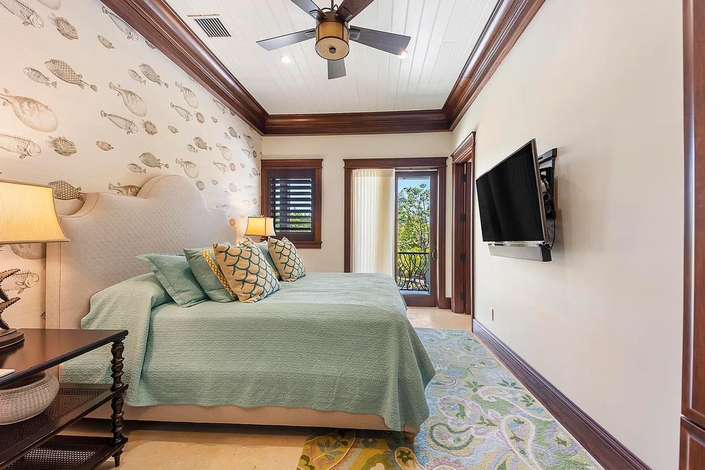 Introducing 1300 Sunset Boulevard, Tarpon Ranch—an elegant private estate in Summerland Key, Florida. Just minutes from Key West, this luxurious property offers relaxed coastal living at its finest. With 6 bedrooms, 8 bathrooms, and 7,720 square feet of living space on a 1.35-acre lot, it's a masterpiece of architectural splendor.