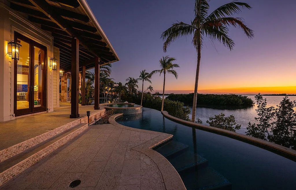 Introducing 1300 Sunset Boulevard, Tarpon Ranch—an elegant private estate in Summerland Key, Florida. Just minutes from Key West, this luxurious property offers relaxed coastal living at its finest. With 6 bedrooms, 8 bathrooms, and 7,720 square feet of living space on a 1.35-acre lot, it's a masterpiece of architectural splendor.