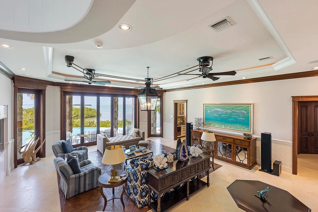 Introducing 1300 Sunset Boulevard, Tarpon Ranch—an elegant private estate in Summerland Key, Florida. Just minutes from Key West, this luxurious property offers relaxed coastal living at its finest. With 6 bedrooms, 8 bathrooms, and 7,720 square feet of living space on a 1.35-acre lot, it's a masterpiece of architectural splendor.
