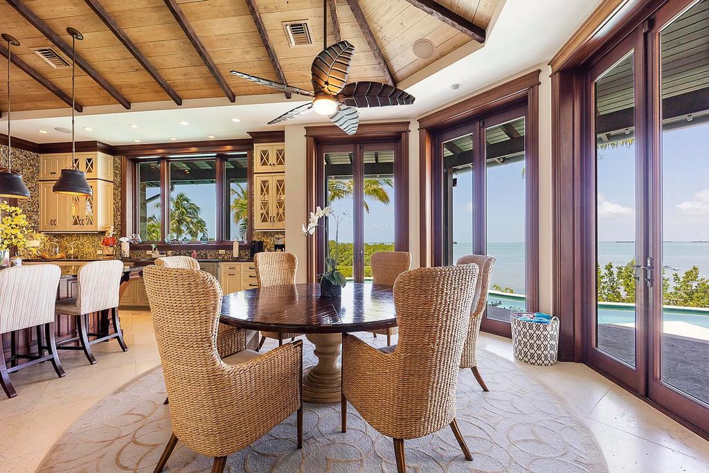 Introducing 1300 Sunset Boulevard, Tarpon Ranch—an elegant private estate in Summerland Key, Florida. Just minutes from Key West, this luxurious property offers relaxed coastal living at its finest. With 6 bedrooms, 8 bathrooms, and 7,720 square feet of living space on a 1.35-acre lot, it's a masterpiece of architectural splendor.
