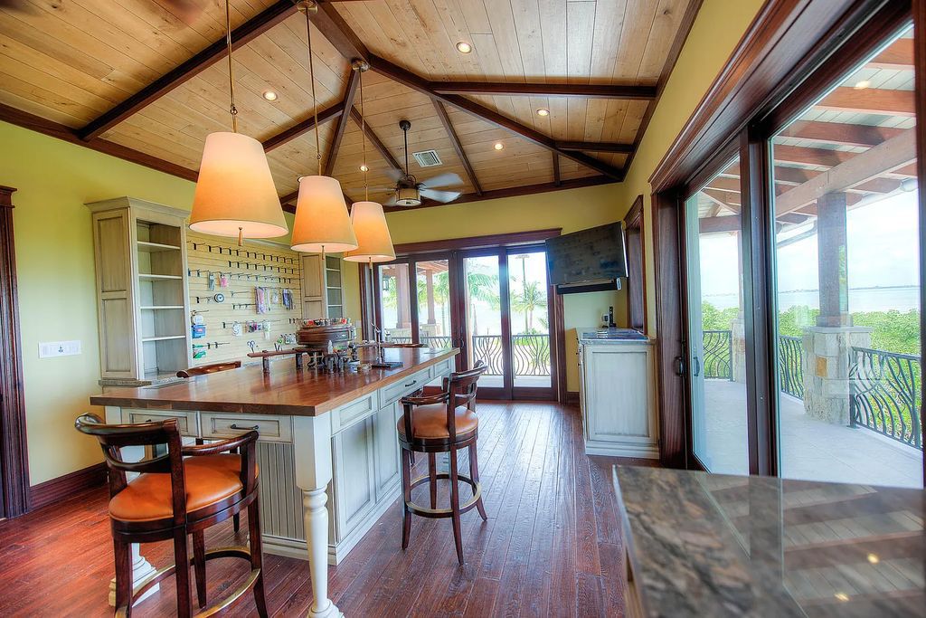 Introducing 1300 Sunset Boulevard, Tarpon Ranch—an elegant private estate in Summerland Key, Florida. Just minutes from Key West, this luxurious property offers relaxed coastal living at its finest. With 6 bedrooms, 8 bathrooms, and 7,720 square feet of living space on a 1.35-acre lot, it's a masterpiece of architectural splendor.
