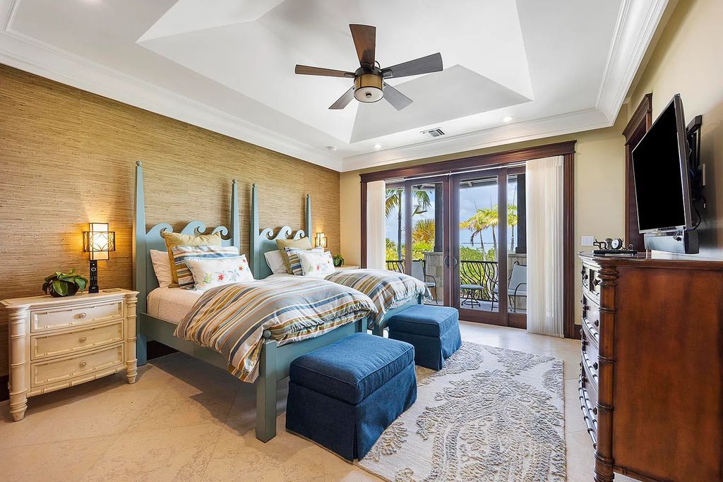 Introducing 1300 Sunset Boulevard, Tarpon Ranch—an elegant private estate in Summerland Key, Florida. Just minutes from Key West, this luxurious property offers relaxed coastal living at its finest. With 6 bedrooms, 8 bathrooms, and 7,720 square feet of living space on a 1.35-acre lot, it's a masterpiece of architectural splendor.